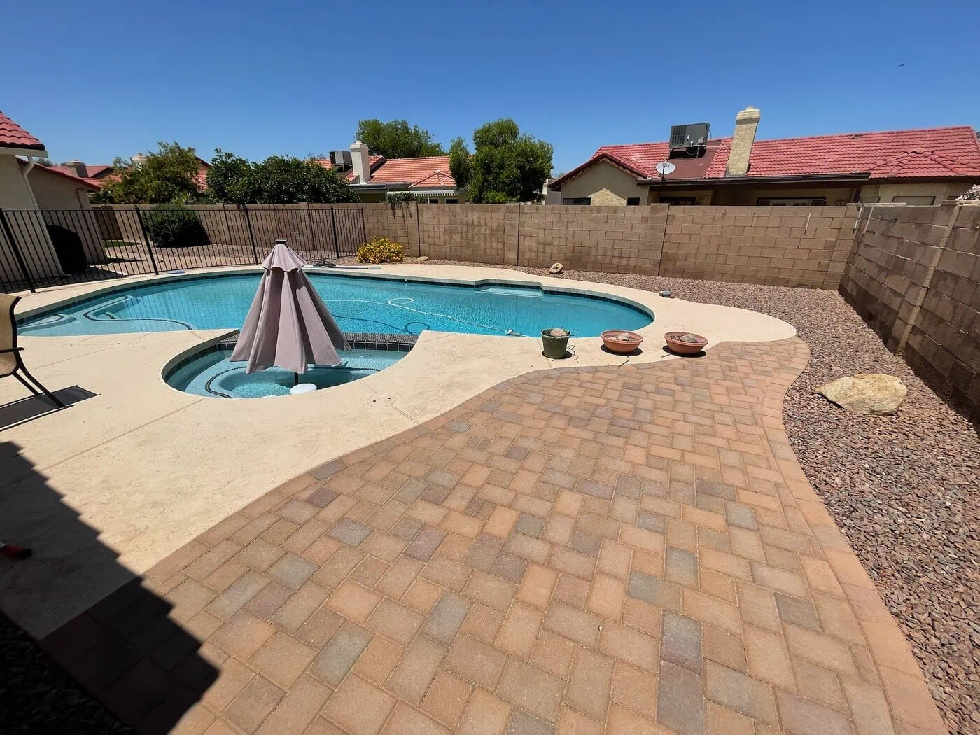 paver pool deck patio installed with Phoenix Pavers, by Oasis Turf and Paver in Surprise Arizona